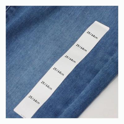 China Garment Label Factory Supply Customized White Film Label Raw Material Clothing Size Sticker Roll Material Garment Size Tape Labels Jumbo Roll for sale