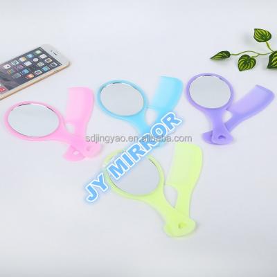 China Economic factory oval cosmetic mirror handle make up mirror portable full set cosmetic mirror wholesale direct selling different colors for sale