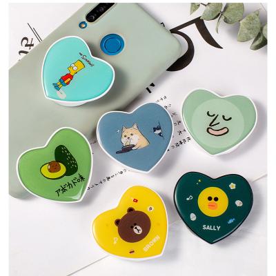 China Height Adjustable Cheap Price Sublimation Epoxy Blank Heart Shape Popings Socket Phone Holder for sale