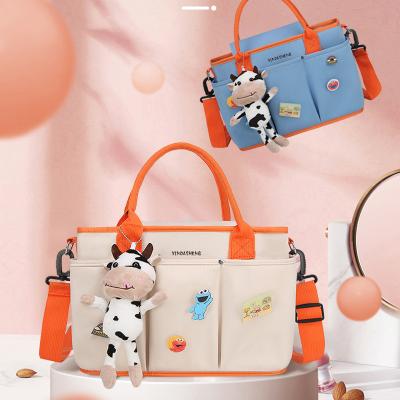 China 2022 New Water Resistant Printing Large Capacity Baby Diaper Handbag Mommy Bag for sale