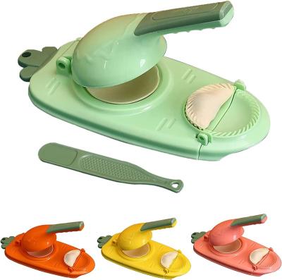 China Who respects the environment. Tiktok Non-Stick Straining Household Plastic Double Head Dum Press Hot Selling Automatic Type With Multiple Mold Dumpling Maker for sale