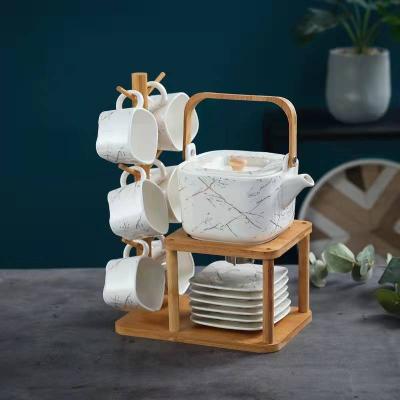 China Viable Japanese Stype Kung Fu Tea Coffee Set Ceramic With Stand Holder Teapot Jug Placed European Afternoon Tea Cup And Saucer Set for sale