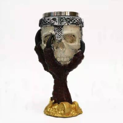 China Retro Modern Skull Ghastly Tumbler Coffee Mug Resin Claw Stainless Steel Statue Claw Wine Cup Drinking Whiskey Mug for sale