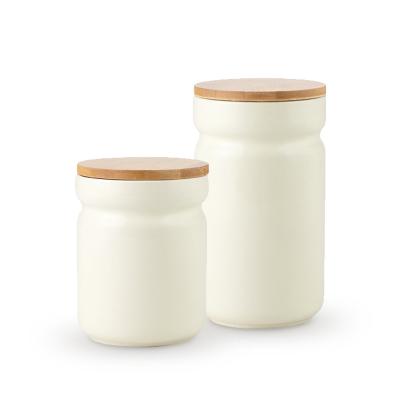 China Microwavable Nordic Ceramic Sealed Tins Coffee Tea Cans Storage Jar With Bamboo Lid for sale