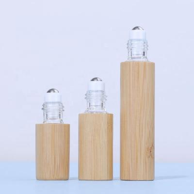 China 10ml small e perfume 5ml cosmetic empty bamboo liquid roll on bottle with stainless steel trackball for eye skin care for sale