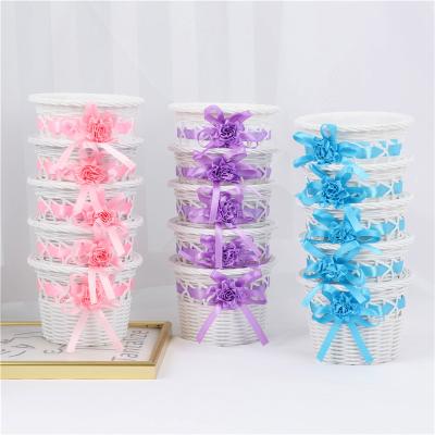 China Simple and modern imitation woven pot of beautiful colorful plastic flower basket small flower artificial flower arrangement for sale