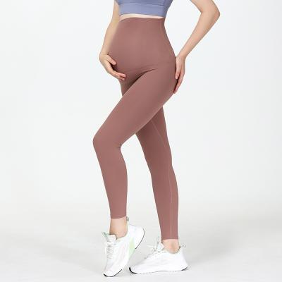 China New Breathable Nude Yoga Pants For Pregnant Women High-waisted Leggings Nine-minute Abdominal Tight Comfort Maternity Pants for sale