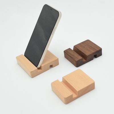 China Fashion Style Cell Phone Stands Real Beech Wood Adjustable Wood Cushion Phone Holder Stand Or Black Walnut for sale