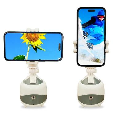 China 360 Degree Rotation Adjustable Smart Phone Holder Automatic Selfie Face Tracking Cell Phone Holders for sale