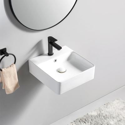 China Wastafel Customized Modern Gantung Hanging Ceramic Hand Basin Height Hotel Bathroom Wash Basins Drop Down for sale