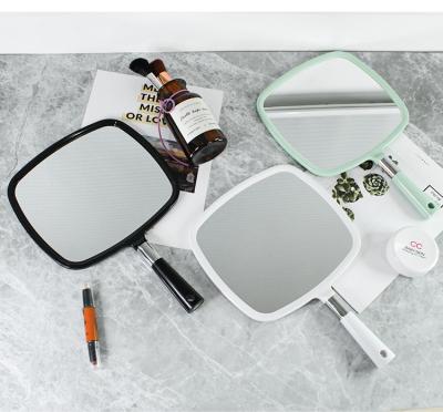 China Custom Made Hand Held Vanity Mirror Makeup Magnifying Cosmetic Hand Held Mirror With Handle for sale