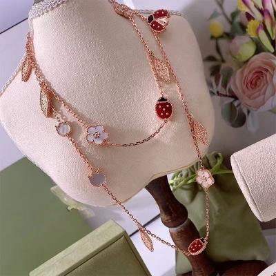 China Romantic High quality lucky four leaf necklace autumn and winter new ladybird 15 flower long sweater chain women's fashion jewelry for sale