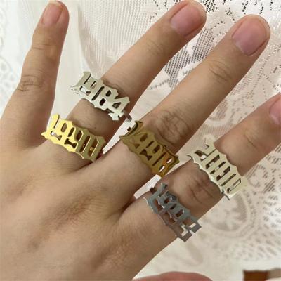 China FASHIONABLE Hot Sale Gold Plated Adjustable Stainless Steel Birth Year Number Angle Rings For Women Men Finger Ring Set Jewelry for sale