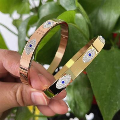 China FASHIONABLE factory bulk gold plated blue evil eye bangle bracelet for women stainless steel eye bracelet men charm jewelry for sale