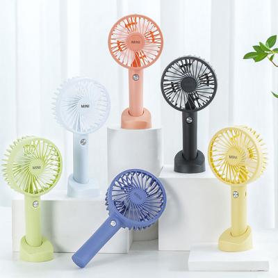 China Small Electric Amazon Fan Mobile Phone Holder USB Adjustable Desktop Handheld Fan Outdoor Portable Vertical Rechargeable Mini Phone Holder for sale