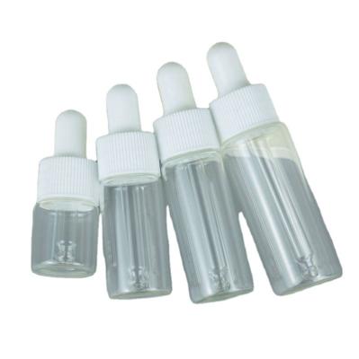 China 5ml 10ml 15ml 20ml Cosmetic Clear Slim Shape Dropper Essential Oil Glass Bottle With White Black Lid And Wide Dropper for sale