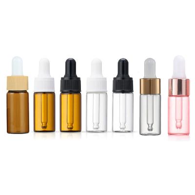 China Cosmetic in 5ml 10ml 15ml 20ml Clear Amber Slim Shape Glass Dropper Essential Oil Stock Bottle with White Black Lid and Wide Dropper for sale