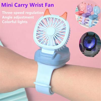 China Detachable Rotating Filling Students Toy Watch Table Fan 2021 Air Cooling Fan Mini Carry Wrist Fan Watch Portable Detachable Wrist Strap USB Newest for sale