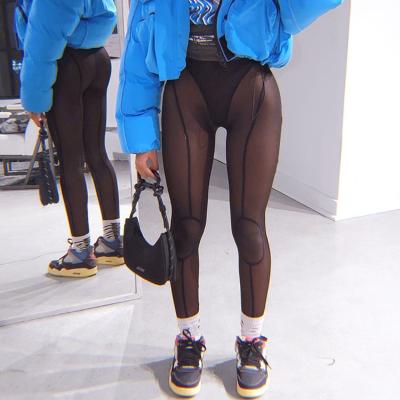 China New Sexy Mesh High-Eaist Buttocks Slimming Breathable Fashion Sports Transparent Casual Pants for sale