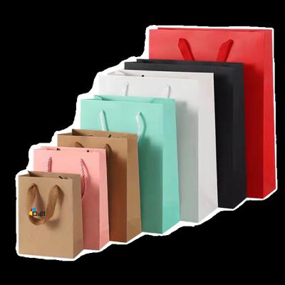 China Various Handmade Promotional Goods Using Paper Custom Clothing Packaging Bags With Handle Ribbon for sale