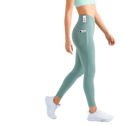 China 2023 New Seamless Sports Tights Women With High Pocket Waist Pants Gym Wear Yoga Gaiters for sale