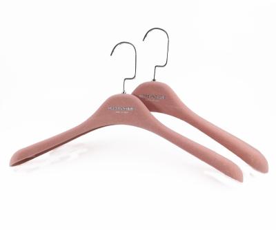 China Hot Sale Velvet Clothing Hanger Pink Flocked Coat Hanger With Wide Shoulder for sale