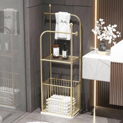 China Light Luxury Floor Towel Rack Fashion Bathroom Storage Rack Iron Laundry Basket Free Punch Marble Rack for sale