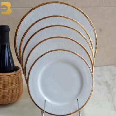 China Wholesale Bone China 5mm Gold Rim Stocked Ceramic Dinner Plates For Weddings for sale