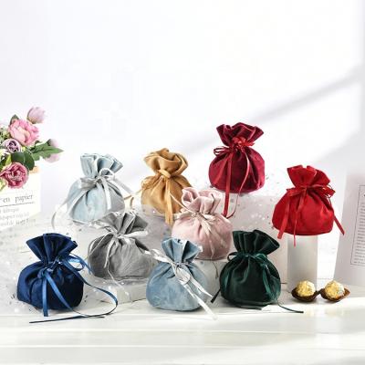 China Moisture Proof Round Bottom Drawstring Flannel Storage Bag Party Wedding Favors Candy Gift Bag Velvet Pouch for sale