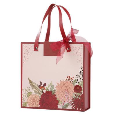 China Uniquecolour Handmade Custom Printing Gift Commercial Luxury Shopping Paper Bag for sale