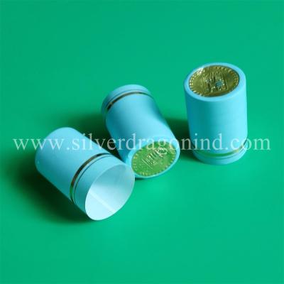 China Blue PVC shrink capsules for drink sealing, size customized, with embossing on top for sale