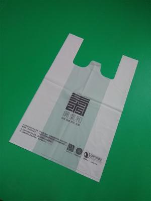 China 100% biodegradable and compostable T-shirt bag, 1 color 2 sides printed, size 0.04mm x (30+16)x46cm, withstand 5kg for sale