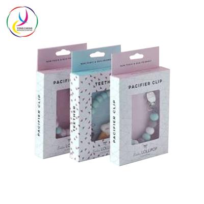 China Recyclable Pacifier Clip Paper Box Care Baby Product Cardboard Packaging for sale