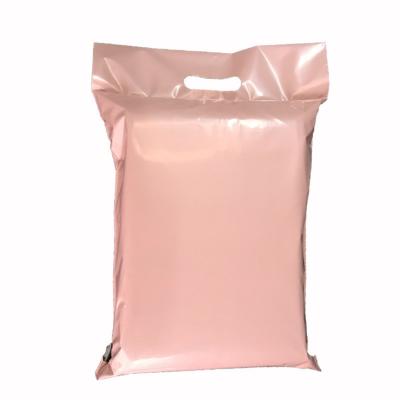 China Tearproof Light Pink Seal Glue Self Envelope Polymailer Plastic Handle Bags for sale