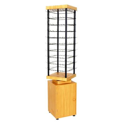 China Floorstanding Hot Selling Customized Rotating Floor Shelves Wood Spinner Display With Drawer For Jewelry for sale