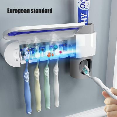 China Automatic Toothbrush Stand Toothpaste Dispenser Home Sterilize Cleaner Sterilize Bathroom Accessories Set for sale