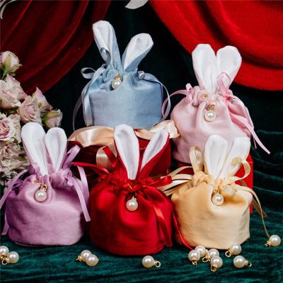 China Wholesale custom made solid fabric eco-friendly solid velvet jewelry string suction box candy ears rabbit wedding packaging bags for sale