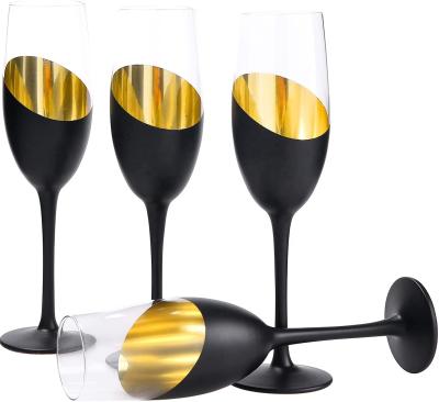 China 2021 New Design Stylish Unique Champagne Flutes Glass Set Matte Black Gold Stemless Wine Titled Glasses for sale