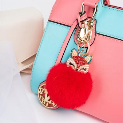 China Auto upholstery hotsale blow pom fluffy pom blow fur key chain for purse pendant for sale