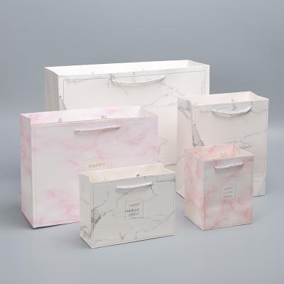 China Recyclable Wholesale Cardboard Packaging Bags Custom Luxury Party Gift Bags Art Paper Shopping Bag for sale