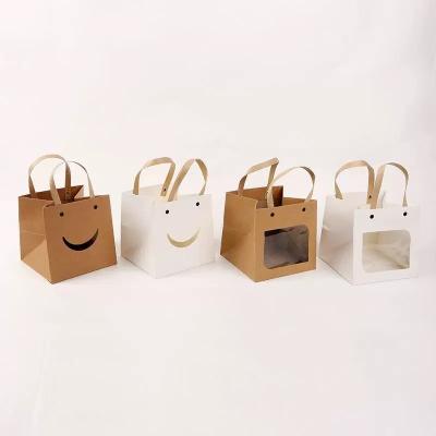 China Hot Selling Recyclable Custom Smile Square Brown White Paper Gift Bottom Buying Packaging Bags With Flat Handle for sale