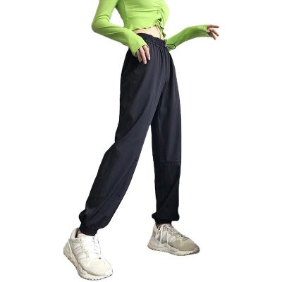 China Anti-wrinkle popular women's loose pants popular women's fitness running pants casual jumpsuits sports pants quick-drying high waist yoga pants for sale