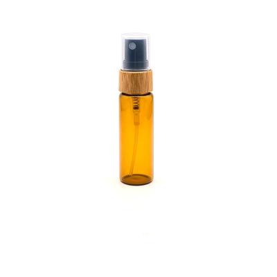 China Amber Bamboo Spray Cosmetic Cap Bottles Mini Glass Cosmetic Perfume Bottle for sale