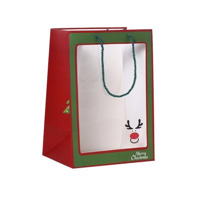 China Wholesale Cheap Recyclable Festival Christmas Bag Gift Packaging Custom LOGO Printed Natural Kraft Recycled Paper Bag With Handle Rope for sale