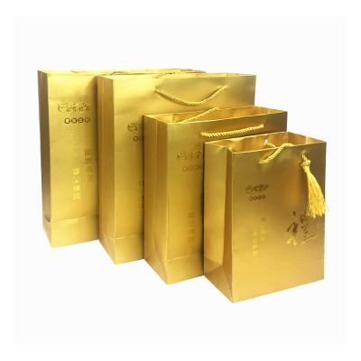 China Recycled Materials Luxury Boutique Hot Stamping Rope Handle Shopping Tote Customized Tote Gold Paper Gift Bags Printed With Logo for sale