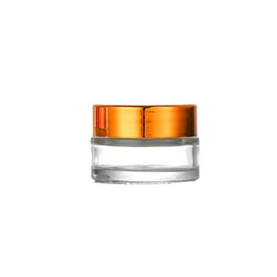 China Personal Care 20g Skin Care Right Side Cream Clear Glass Jars With Gold Foil Cap for sale