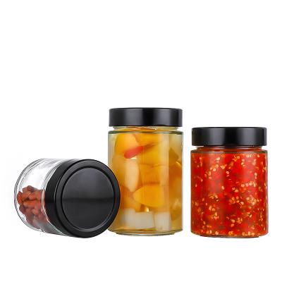 China Hot Sale Beautiful Round Shape Kitchen Container Clear Food Storage Glass Jar With Metal Lid for sale