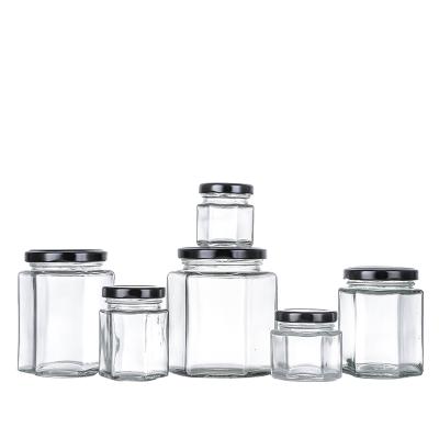 China Wholesale Clear Food Hexagon Shaped Airtight Glass Storage Jar With Metal Screw Lid for sale