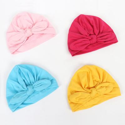 China 100% Cotton Hospital Newborn Baby Hat Infant Hat With Big Bow Knot Soft Cute Nursery Skullcap for sale