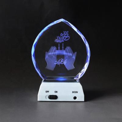 China Islamic Middle East Gifts Leaf Shaped Crystal Glass With Led Light Base Laser Engraved Hand With Mosque Minaret Decoration for sale